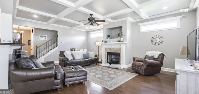 living room with a high end fireplace, beamed ceiling, dark wood-type flooring, and coffered ceiling