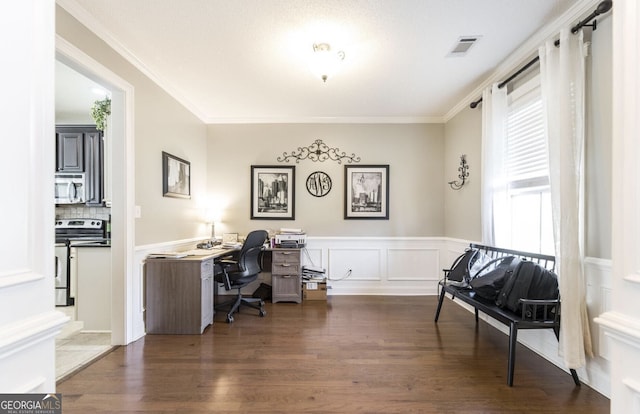 office space with a wealth of natural light, dark hardwood / wood-style flooring, and ornamental molding