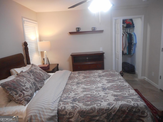 bedroom featuring ceiling fan and a closet