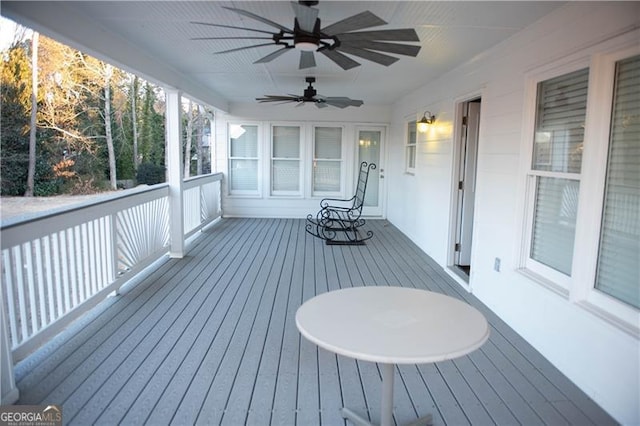 wooden deck with ceiling fan and covered porch