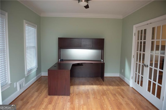 unfurnished office featuring ceiling fan, french doors, light wood-type flooring, and ornamental molding