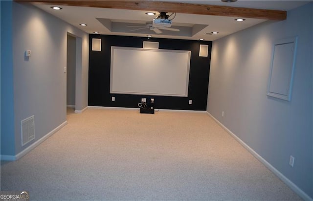 cinema featuring ceiling fan and light colored carpet