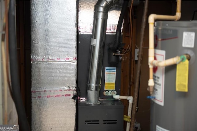 utility room featuring water heater