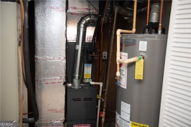 utility room featuring gas water heater