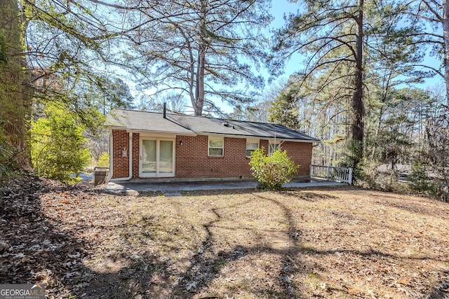 rear view of property with a patio area