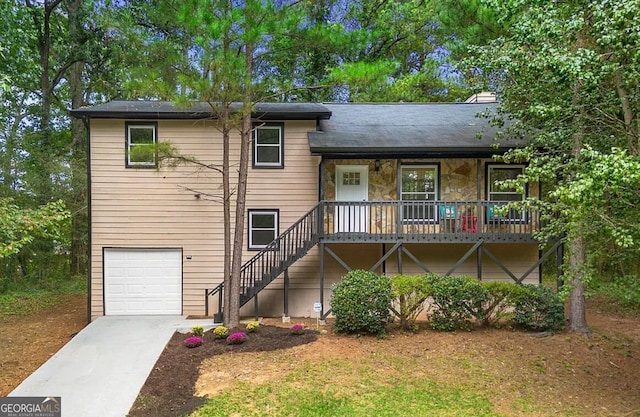 view of front of property featuring covered porch and a garage