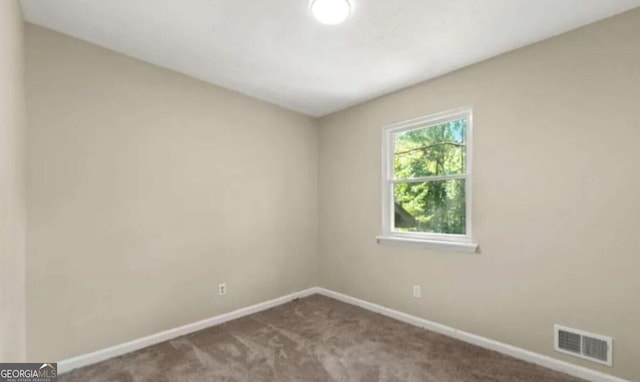 view of carpeted spare room