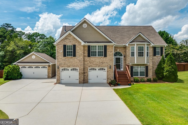 bi-level home with a front yard and a garage