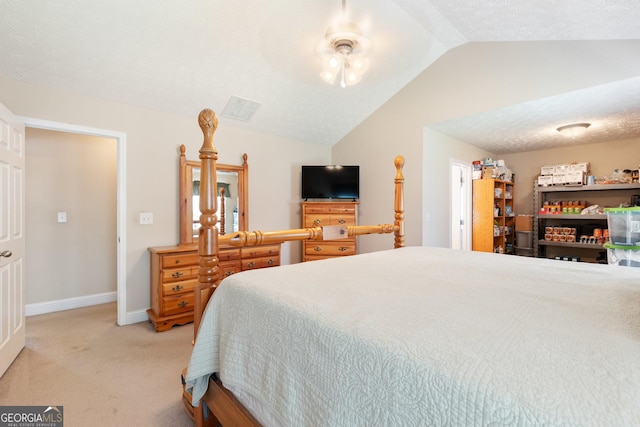 carpeted bedroom with ceiling fan, lofted ceiling, and a textured ceiling