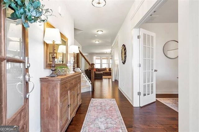 corridor featuring dark hardwood / wood-style floors