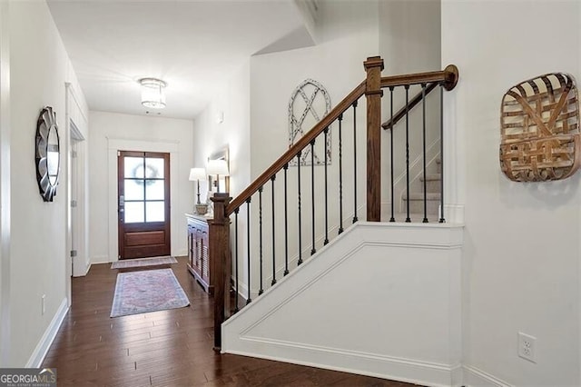 foyer with dark hardwood / wood-style floors