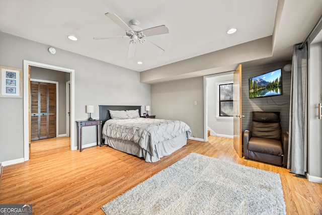 bedroom featuring light hardwood / wood-style flooring and ceiling fan