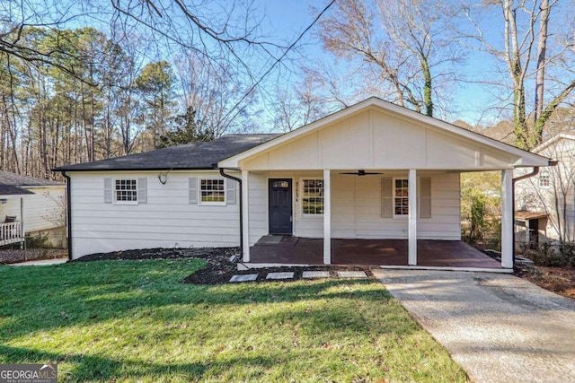 view of front facade with a front lawn and a porch