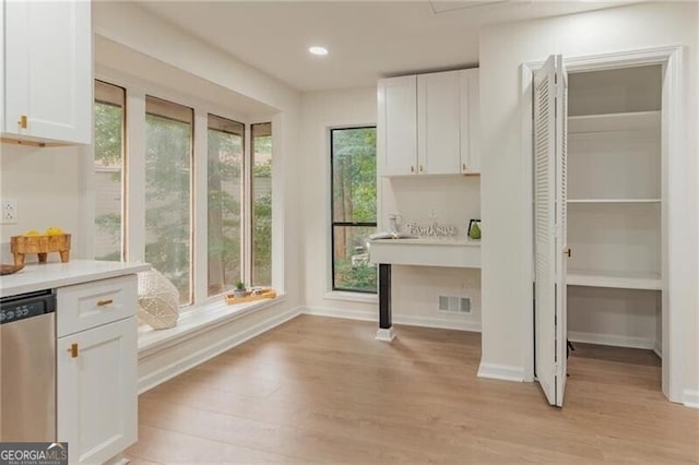 washroom with light hardwood / wood-style flooring