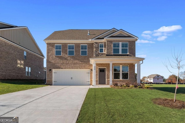 view of front of house with a garage and a front lawn