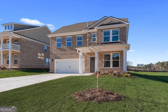 view of front of house with a front yard and a garage