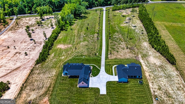 birds eye view of property with a rural view