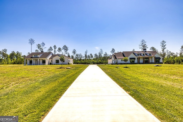 cape cod house featuring a front lawn