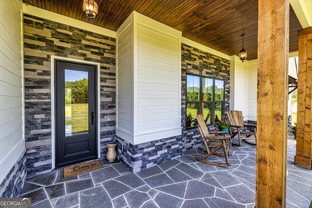 property entrance featuring a porch