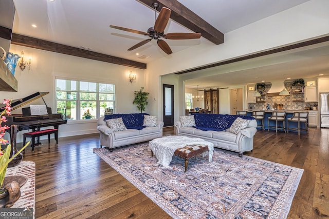 living room with beamed ceiling, dark hardwood / wood-style floors, and ceiling fan