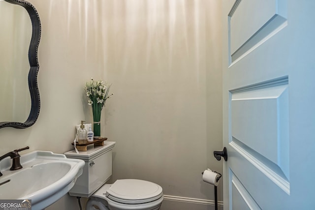 bathroom with sink and toilet