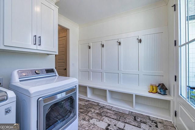 laundry area featuring cabinets and separate washer and dryer