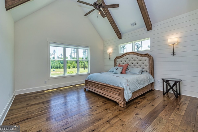 bedroom featuring ceiling fan, dark wood-type flooring, high vaulted ceiling, and multiple windows