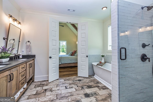 bathroom with vanity, ornamental molding, and shower with separate bathtub