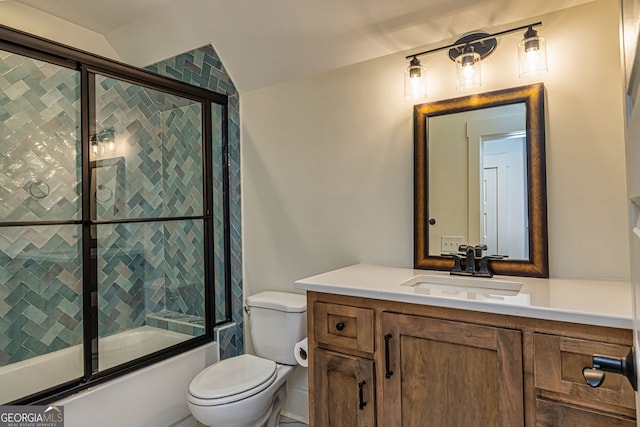 full bathroom featuring vanity, toilet, bath / shower combo with glass door, and vaulted ceiling