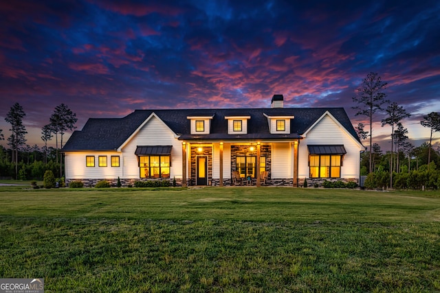 modern farmhouse featuring a yard