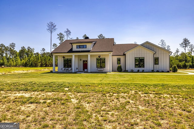 view of front of home featuring a porch and a front lawn