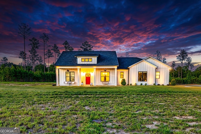 modern farmhouse featuring a yard