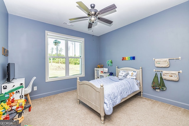 carpeted bedroom with ceiling fan