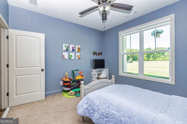 carpeted bedroom featuring ceiling fan