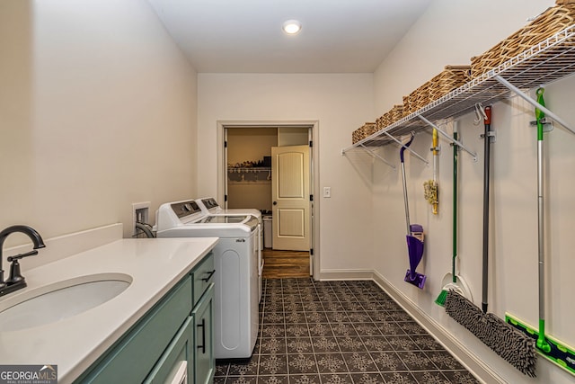 laundry area featuring washer and clothes dryer and sink