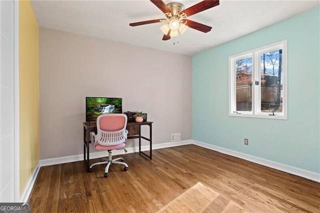 office space featuring ceiling fan and wood-type flooring