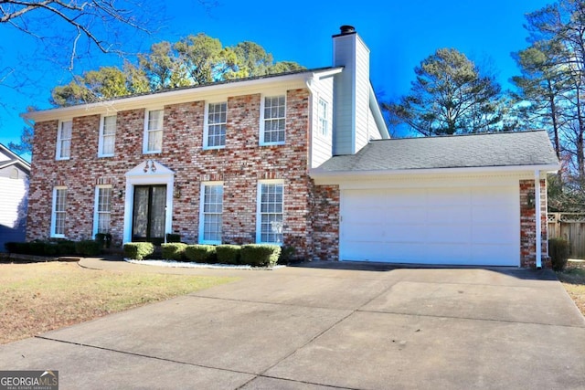 colonial inspired home with a garage