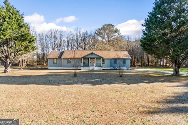 view of front of property with a porch and a front yard