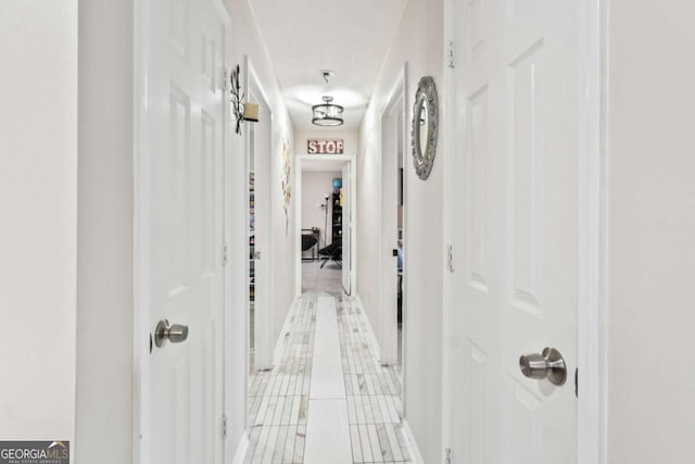 hall with light tile patterned flooring