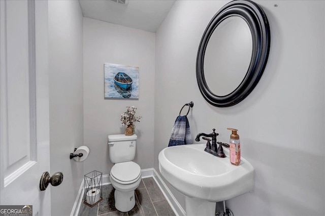 bathroom featuring sink and toilet