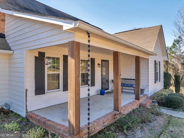 view of exterior entry featuring a porch