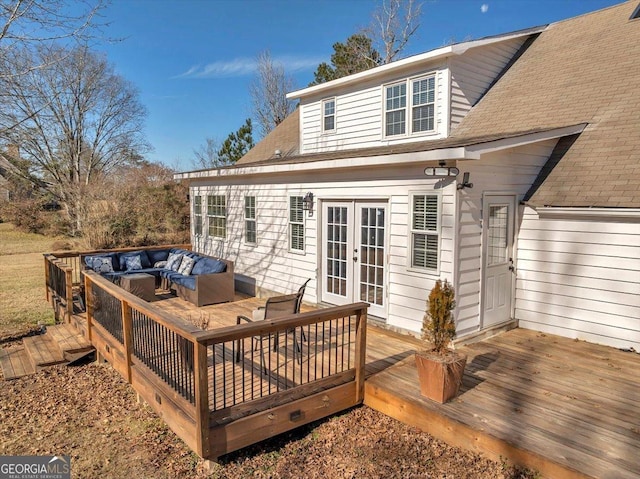 wooden deck with french doors and an outdoor living space