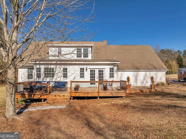 back of property featuring a wooden deck