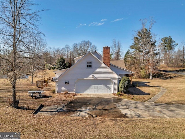 view of side of property with a garage