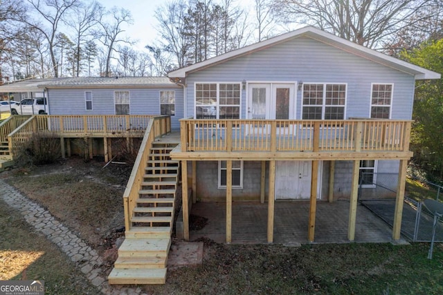 back of property with a wooden deck