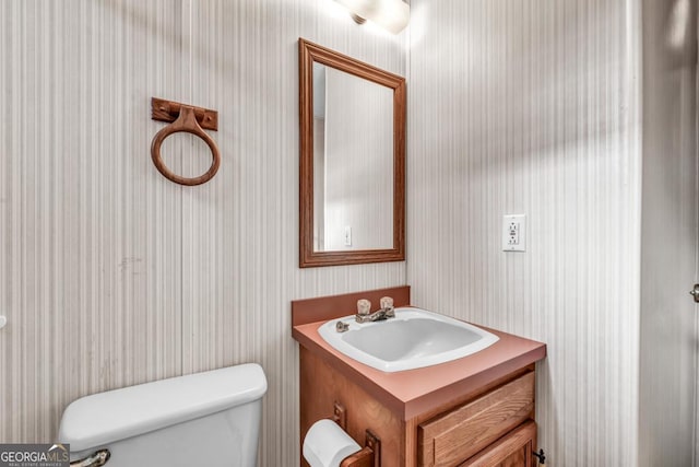 bathroom with vanity and toilet