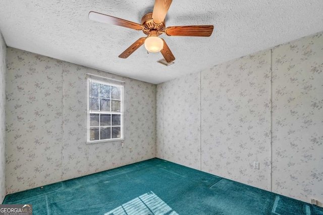 carpeted empty room with ceiling fan