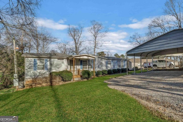 view of front of property featuring a front lawn and a carport