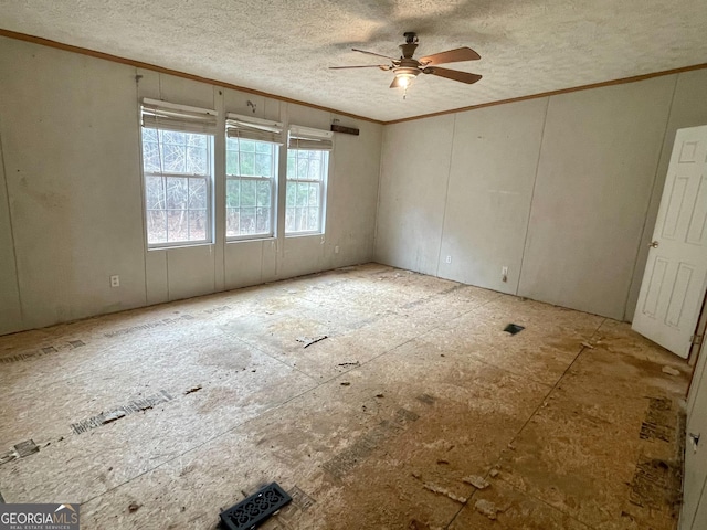 unfurnished room with ornamental molding and ceiling fan