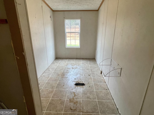 unfurnished bedroom with a textured ceiling